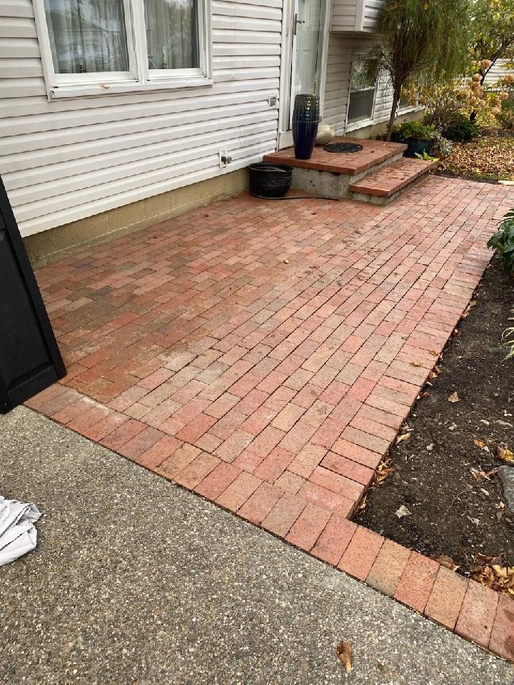 Brick paver patio installation by Mark Monnette Masonry